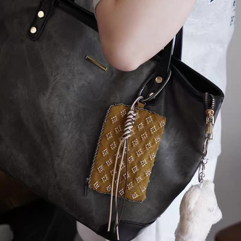 Mini borse con ciondoli per ac - Luxury Bags Designer recensione e prezzo
